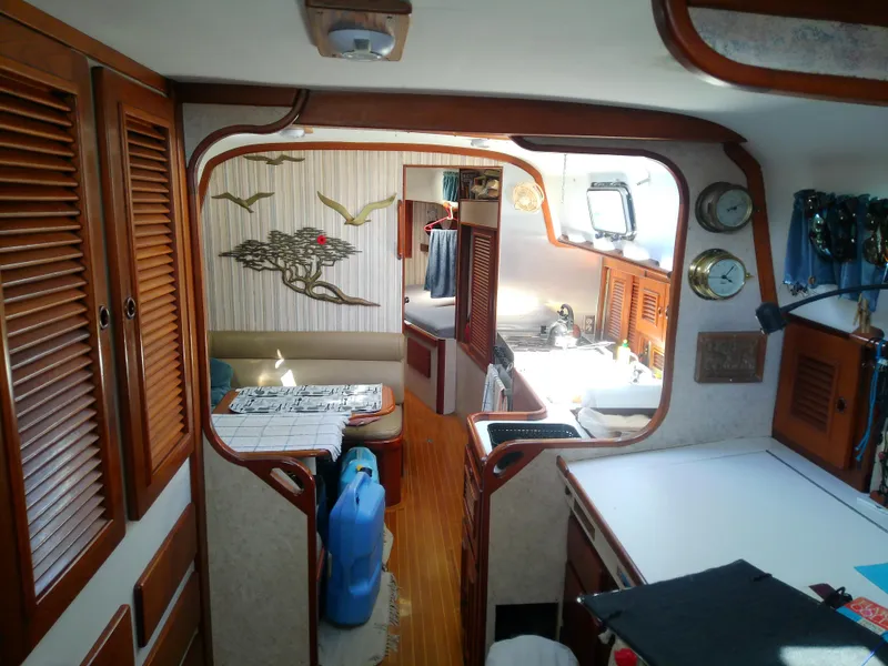 Slide: The Image of Interior of a 1971 Morgan 40 Cruising Ketch with wood accents and nautical decor. - 44