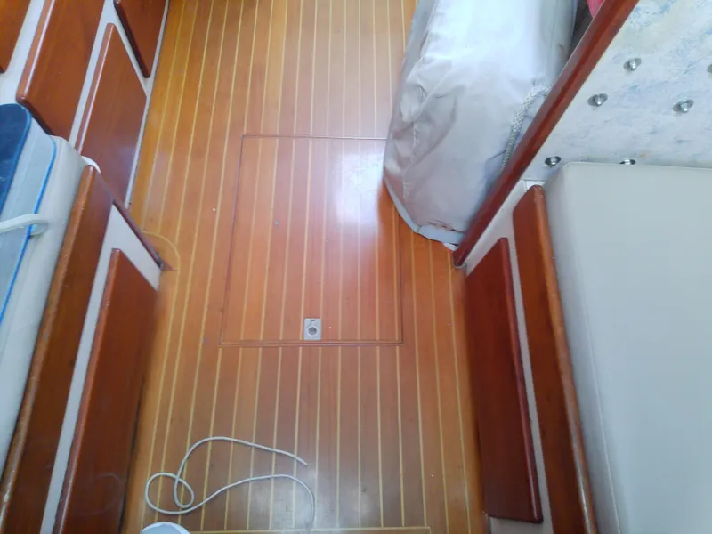 Slide: The Image of Interior view of 1971 Morgan 40 Cruising Ketch with wooden flooring and seating. - 45