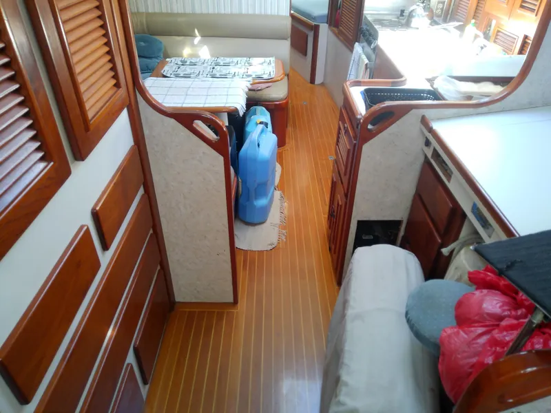 Slide: The Image of Interior of 1971 Morgan 40 Cruising Ketch with wooden flooring and dining area. - 46
