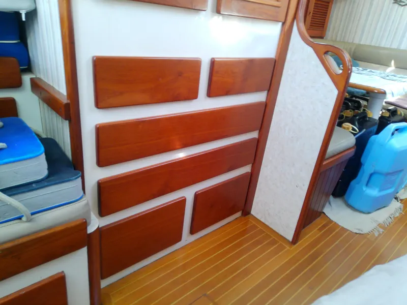 Slide: The Image of Interior of a 1971 Morgan 40 Cruising Ketch with wooden paneling and storage. - 48