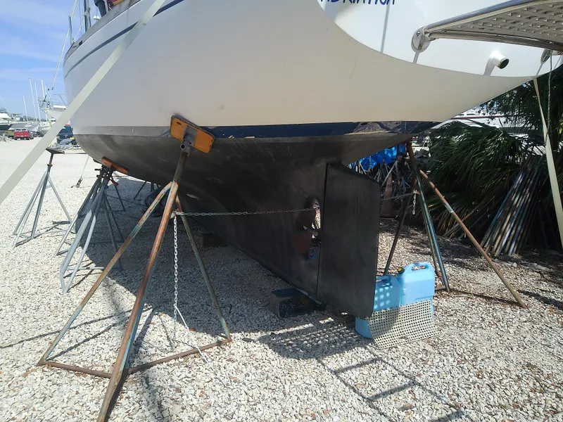 Slide: The Image of 1971 Morgan 40 Cruising Ketch on stands, hull and rudder visible. - 6