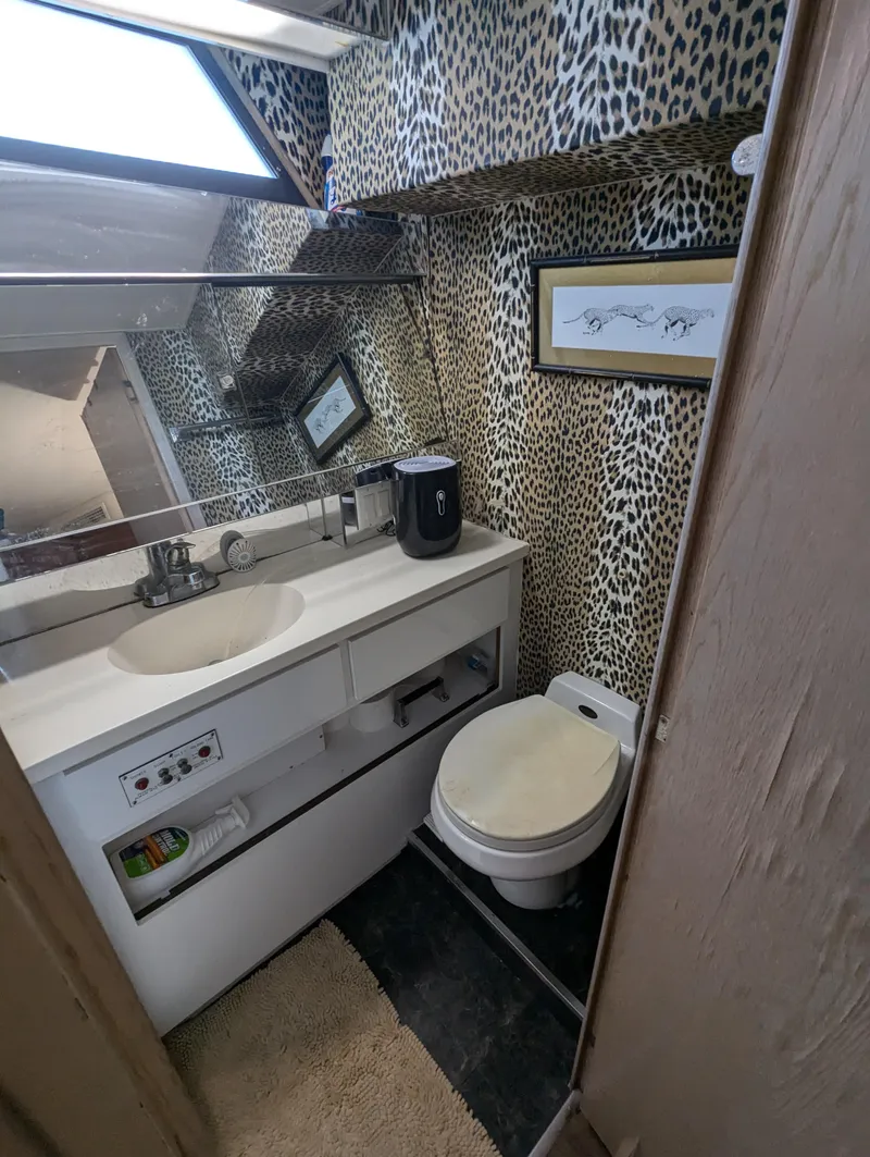 Slide: The Image of Bathroom with leopard print wallpaper in 1996 Hatteras 42 Cockpit MY yacht. - 11