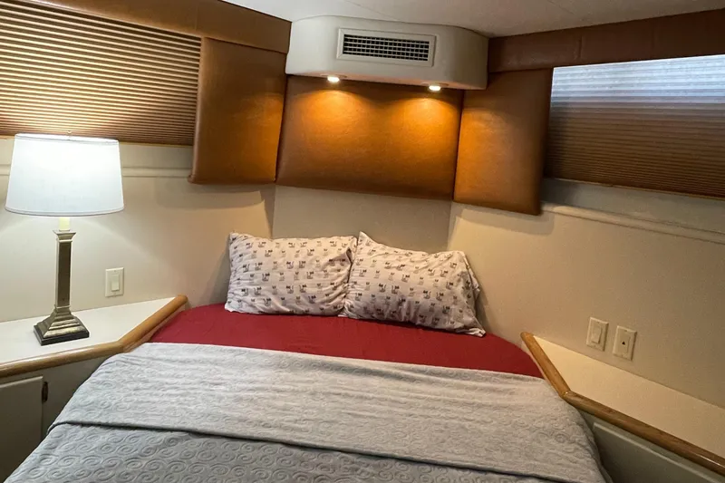 Slide: The Image of Cozy bedroom interior of 1996 Hatteras 42 Cockpit MY yacht with elegant lighting. - 12