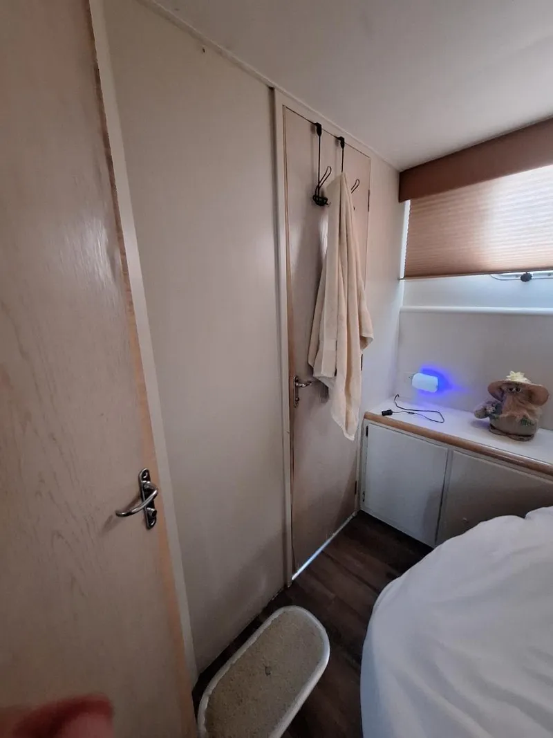 Slide: The Image of Interior of 1996 Hatteras 42 Cockpit MY yacht cabin with modern decor. - 27