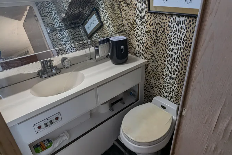 Slide: The Image of Bathroom with leopard print wallpaper in 1996 Hatteras 42 Cockpit MY yacht. - 8
