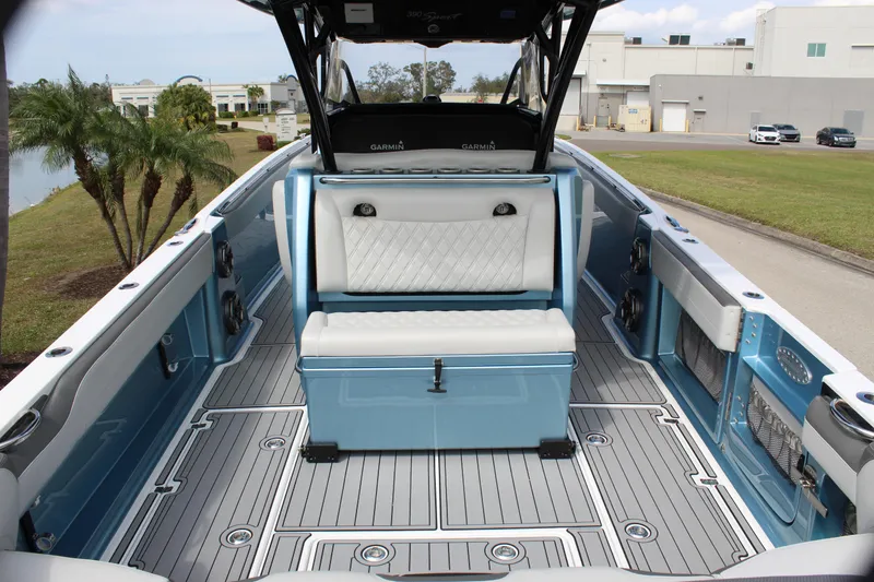 Slide: The Image of 2021 Nor-Tech 390 Sport Center Console boat with spacious deck and seating. - 30