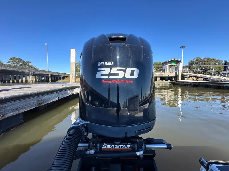Slide: The Image of Yamaha 250 outboard motor on 2021 Sportsman Masters 247 Bay Boat at dock. - 12