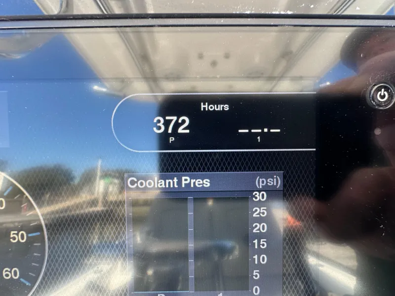 Slide: The Image of Display screen showing 372 hours and coolant pressure on a 2021 Sportsman Masters 247 Bay Boat. - 15