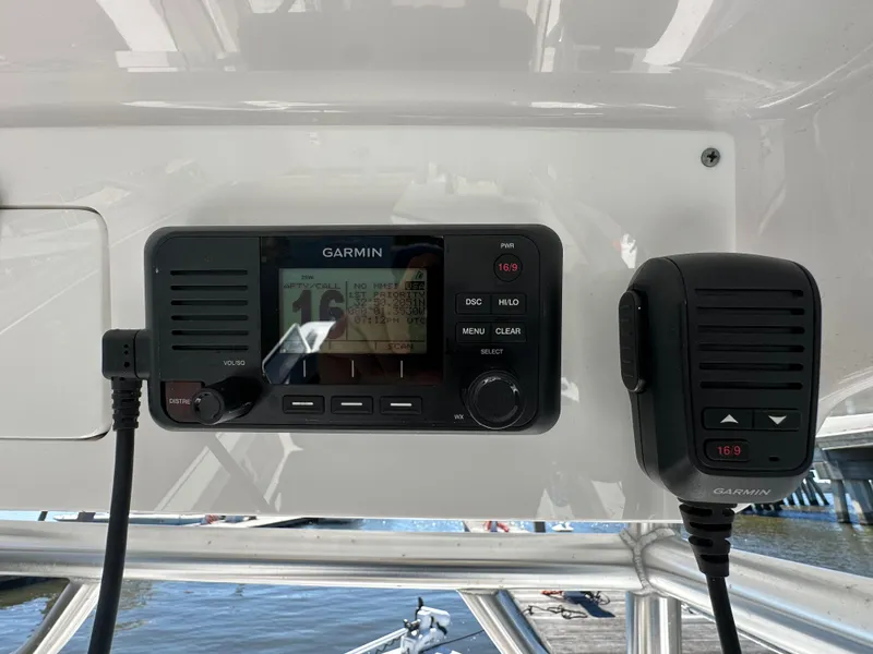 Slide: The Image of Garmin marine radio on 2021 Sportsman Masters 247 Bay Boat dashboard. - 17