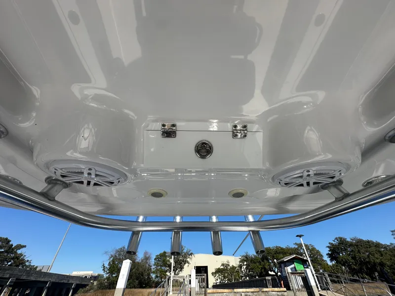 Slide: The Image of 2021 Sportsman Masters 247 Bay Boat T-top with speakers and rod holders. - 33