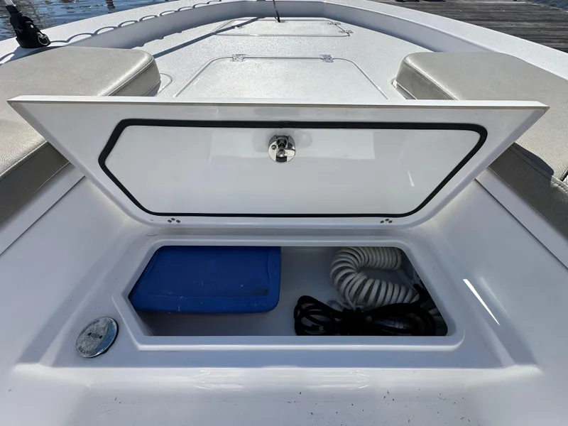 Slide: The Image of Storage compartment on 2021 Sportsman Masters 247 Bay Boat, featuring organized interior space. - 34