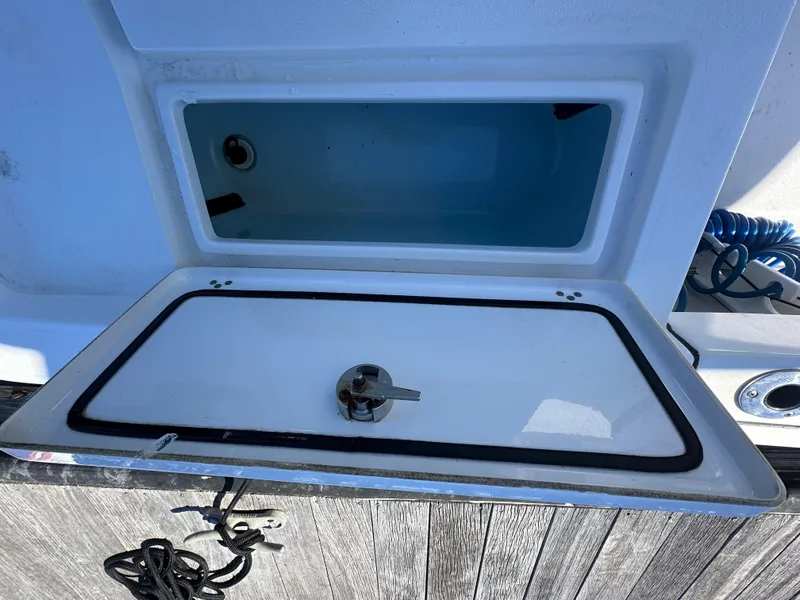 Slide: The Image of Livewell compartment on a 2021 Sportsman Masters 247 Bay Boat, open and empty. - 38