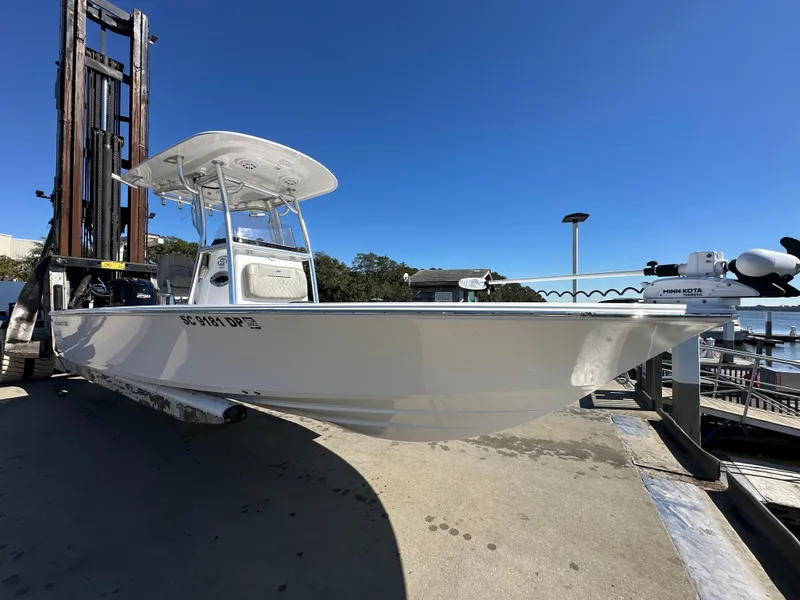Slide: The Image of 2021 Sportsman Masters 247 Bay Boat on dock under clear blue sky. - 8