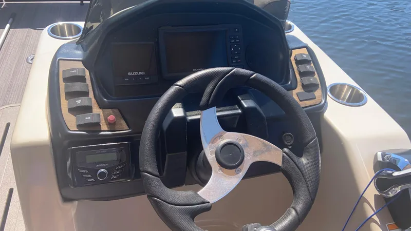 Slide: The Image of Steering console of 2022 Veranda Relax VR22RC boat with modern controls and display. - 11