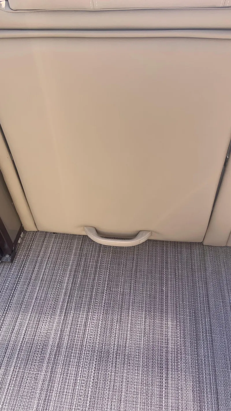 Slide: The Image of 2022 Veranda Relax VR22RC interior detail with textured flooring and storage compartment. - 13