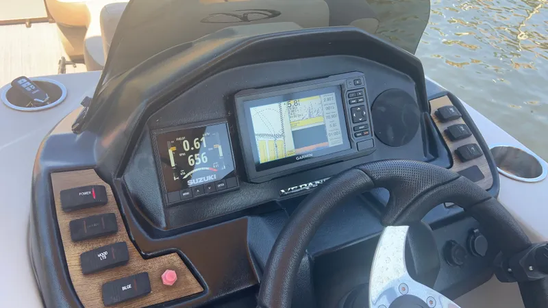 Slide: The Image of 2022 Veranda Relax VR22RC boat dashboard with navigation and control panels. - 21