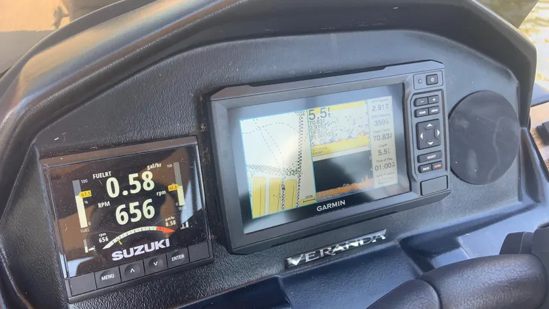 Slide: The Image of Dashboard of 2022 Veranda Relax VR22RC with Suzuki and Garmin displays. - 24