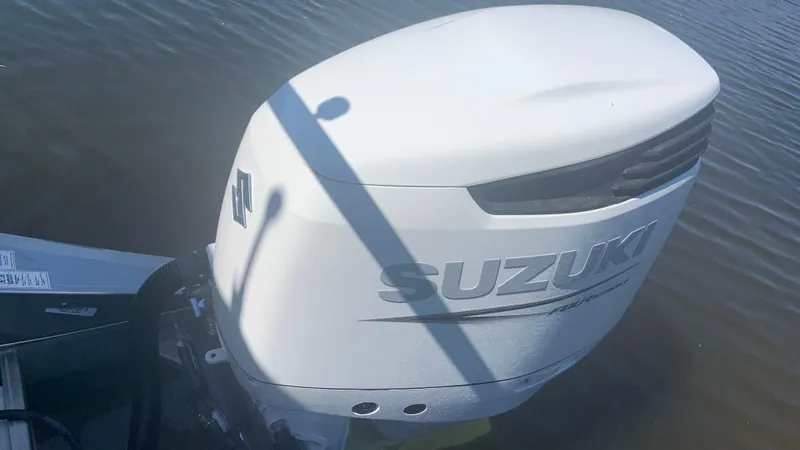Slide: The Image of Suzuki outboard motor on Veranda Relax VR22RC 2022 boat in water. - 9
