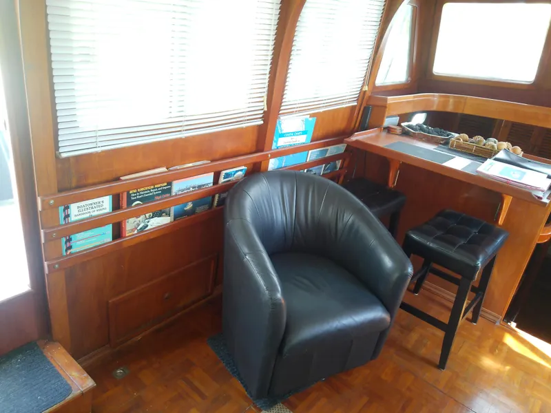 Slide: The Image of Interior of 1987 Albin 40 boat with leather chair and wooden furnishings. - 22
