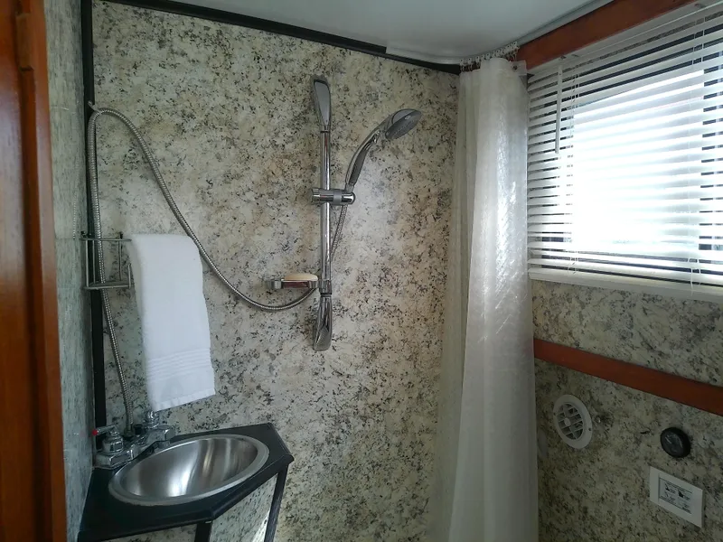 Slide: The Image of Bathroom interior of 1987 Albin 40 boat with shower and sink. - 35