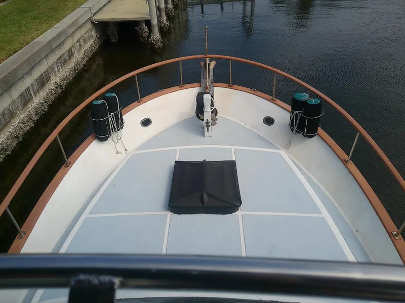 Slide: The Image of 1987 Albin 40 boat deck view, docked by calm waters. - 46