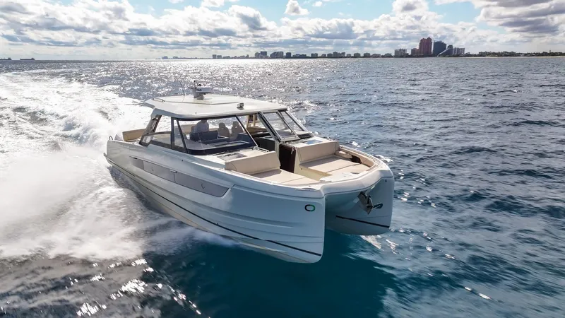 The Image of 2025 Catana YOT 41 cruising on open water under a partly cloudy sky. - 0
