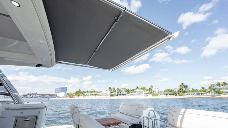 Slide: The Image of Catana YOT 41 (2025) yacht with awning, ocean view, and sunny sky. - 10