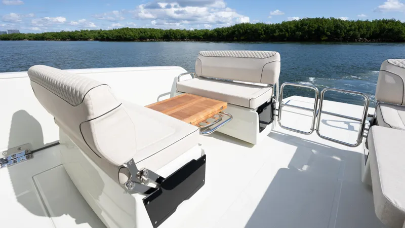 Slide: The Image of Luxurious Catana YOT 41 yacht interior, 2025 model, featuring elegant seating and scenic water view. - 13