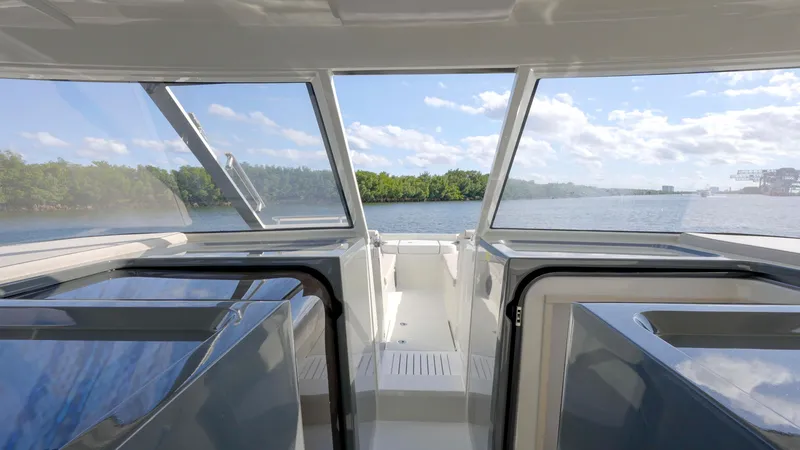 Slide: The Image of Interior view of 2025 Catana YOT 41 yacht with scenic waterway backdrop. - 14