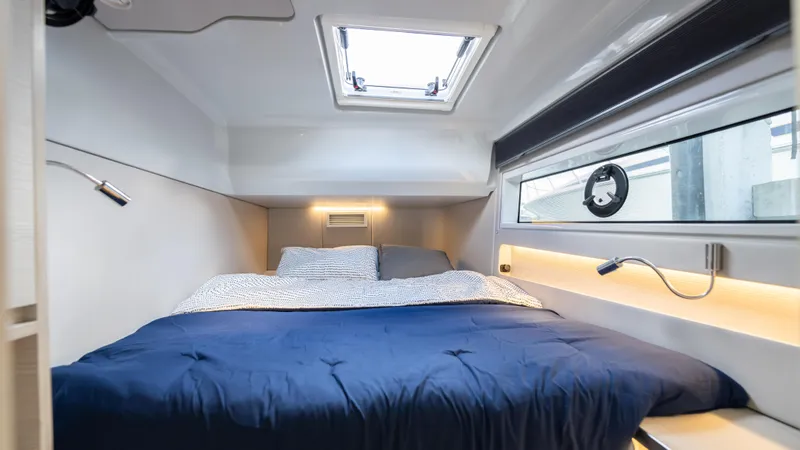 Slide: The Image of Luxurious cabin interior of 2025 Catana YOT 41 with skylight and modern bedding. - 19