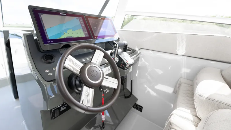 Slide: The Image of Interior helm of 2025 Catana YOT 41 with modern navigation displays and steering wheel. - 20