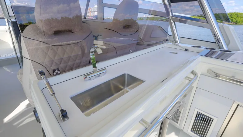 Slide: The Image of Interior of 2025 Catana YOT 41 yacht with modern seating and sleek sink design. - 5