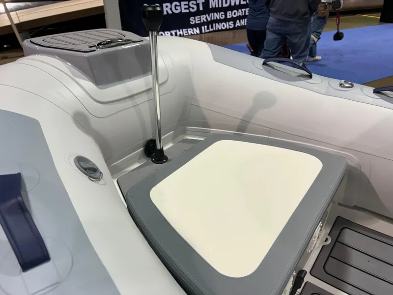 Slide: The Image of 2025 Highfield Classic 340 FCT boat interior with steering console and seating. - 11