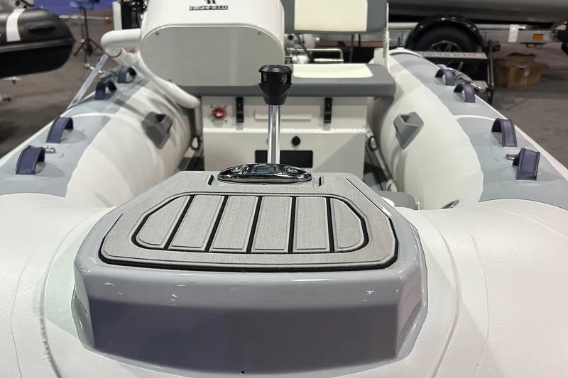 Slide: The Image of 2025 Highfield Classic 340 FCT inflatable boat interior with control panel and seating. - 4