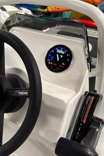 Slide: The Image of 2023 Highfield Sport 330 dashboard with steering wheel and digital display. - 12