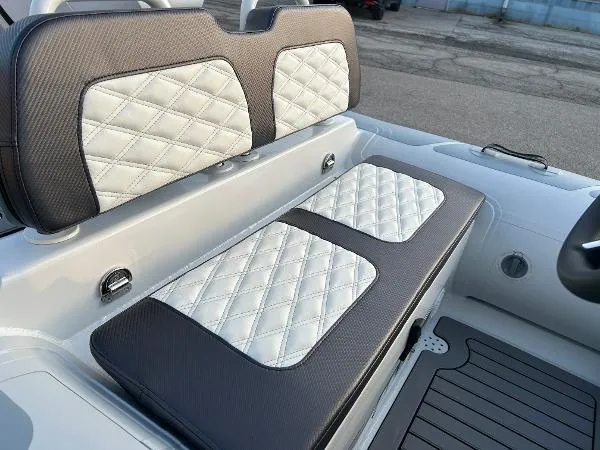 Slide: The Image of 2023 Highfield Sport 330 boat with quilted white and gray seating. - 14