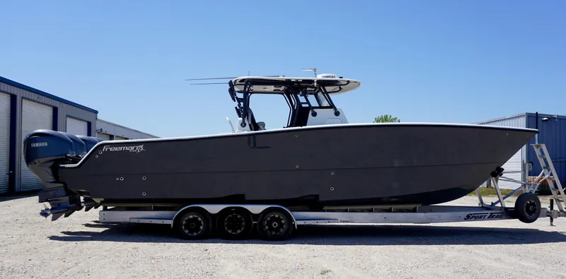 Slide: The Image of 2020 Freeman 37 VH boat on trailer, side view, outdoors. - 15