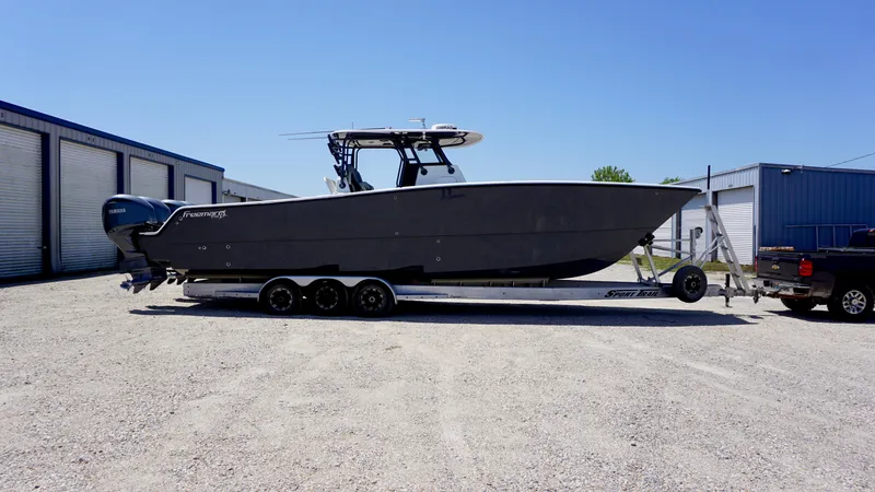 Slide: The Image of 2020 Freeman 37 VH boat on trailer in storage yard. - 19