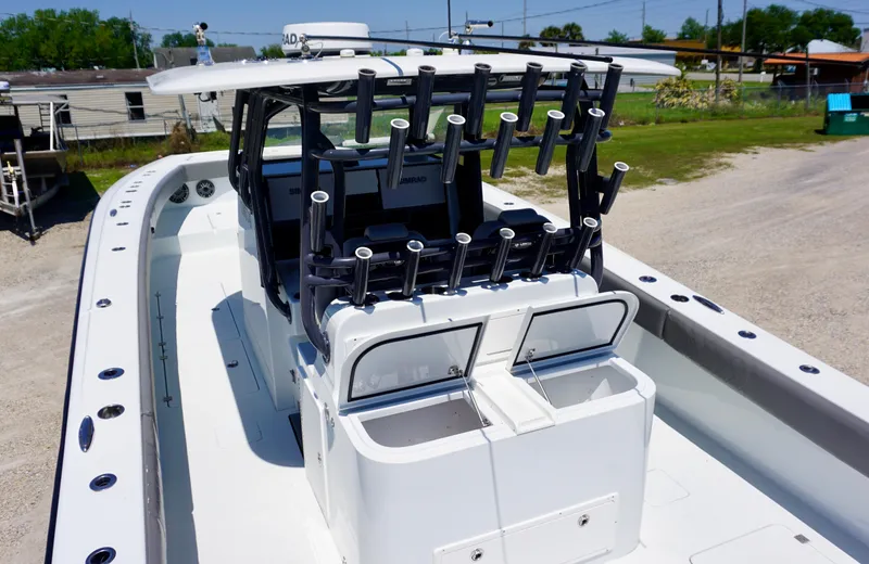 Slide: The Image of 2020 Freeman 37 VH boat with multiple rod holders, white deck, and spacious seating area. - 26