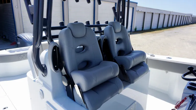 Slide: The Image of Two gray captain's chairs on a 2020 Freeman 37 VH boat. - 33