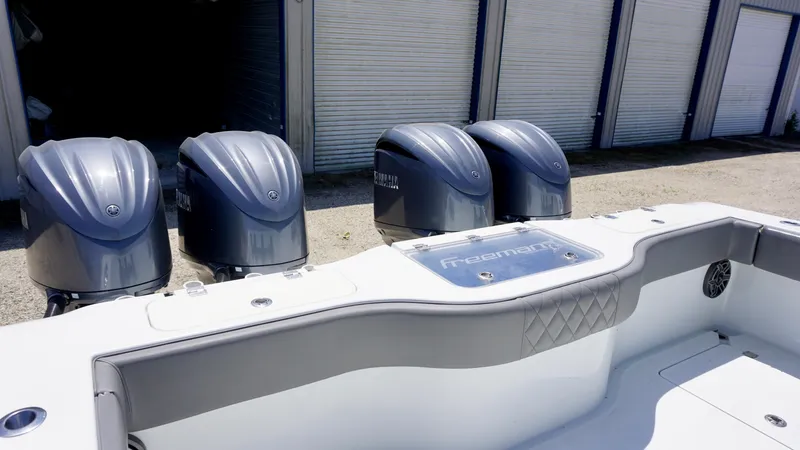 Slide: The Image of Freeman 37 VH 2020 boat with four powerful outboard engines in a storage area. - 34