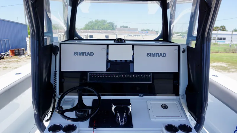 Slide: The Image of Control console of a 2020 Freeman 37 VH boat with Simrad navigation system. - 38