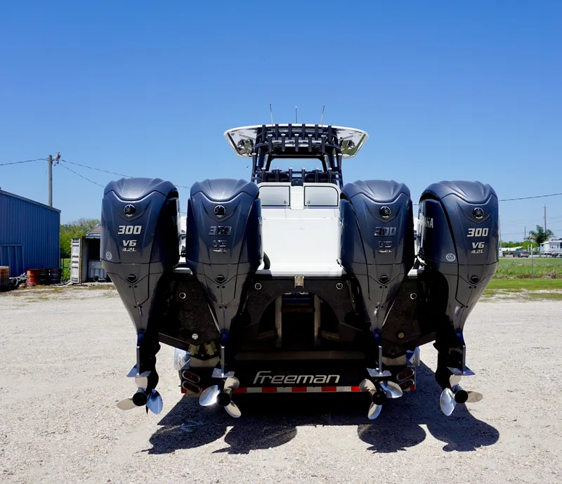 Slide: The Image of Freeman 37 VH 2020 boat with four powerful outboard engines, rear view. - 8