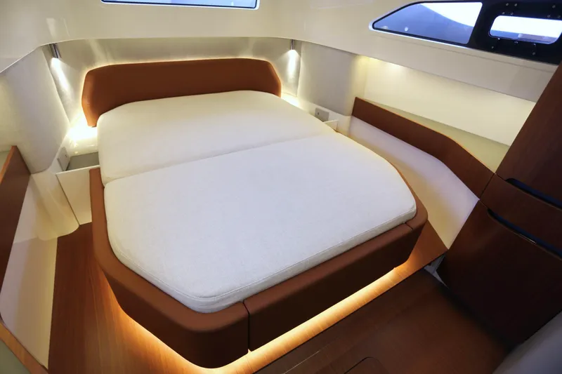 Slide: The Image of Luxurious interior of 2026 Capelli Stradivari 52 yacht with elegant bed and ambient lighting. - 12