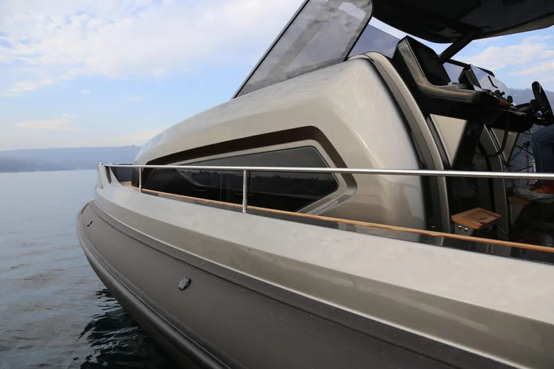Slide: The Image of 2026 Capelli Stradivari 52 luxury yacht on calm water, showcasing sleek design and modern features. - 7