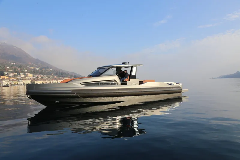 Slide: The Image of 2026 Capelli Stradivari 52 luxury boat cruising on calm waters under a clear sky. - 8