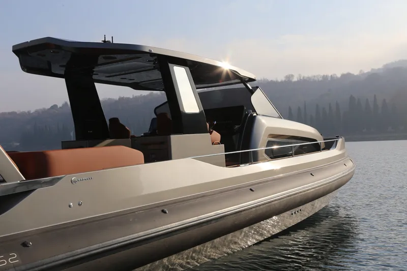 Slide: The Image of 2026 Capelli Stradivari 52 luxury boat cruising on a serene lake. - 9