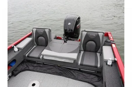 Slide: The Image of 2023 Lund 1775 Adventure Sport boat interior with seating and motor on water. - 4