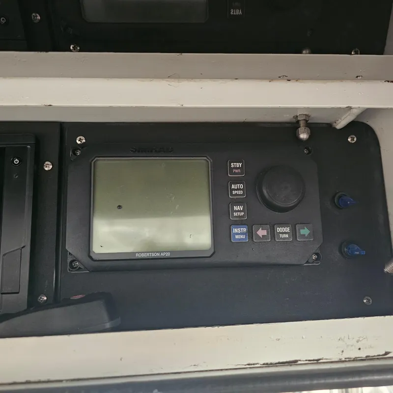 Slide: The Image of 1994 Blackfin 33 Combi control panel with Robertson AP300 autopilot system. - 11
