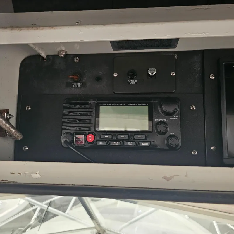 Slide: The Image of 1994 Blackfin 33 Combi boat radio and control panel close-up. - 12